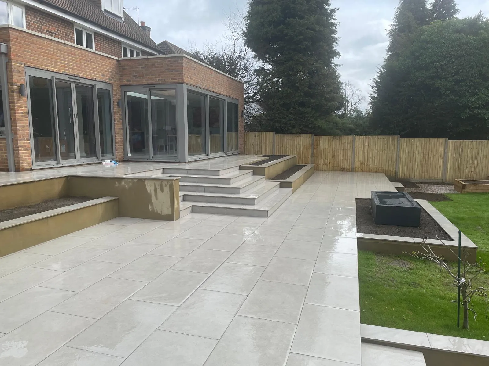A patio with steps leading up to a building.